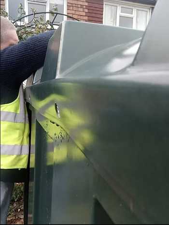 A member of the team working on an oil tank installation