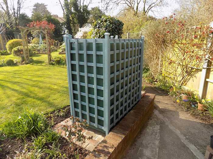 sunny garden with oil tank