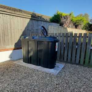 oil tank with wooden fence